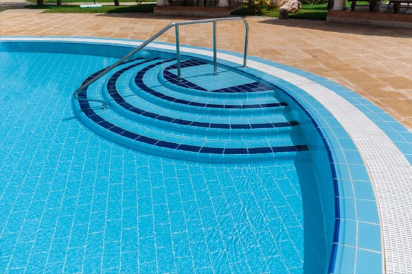 Emergency-Repair-Services This image shows a pool deck with pavers that was resurfaced.