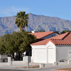 This image shows a house in Las Vegas with a mountain behind it.